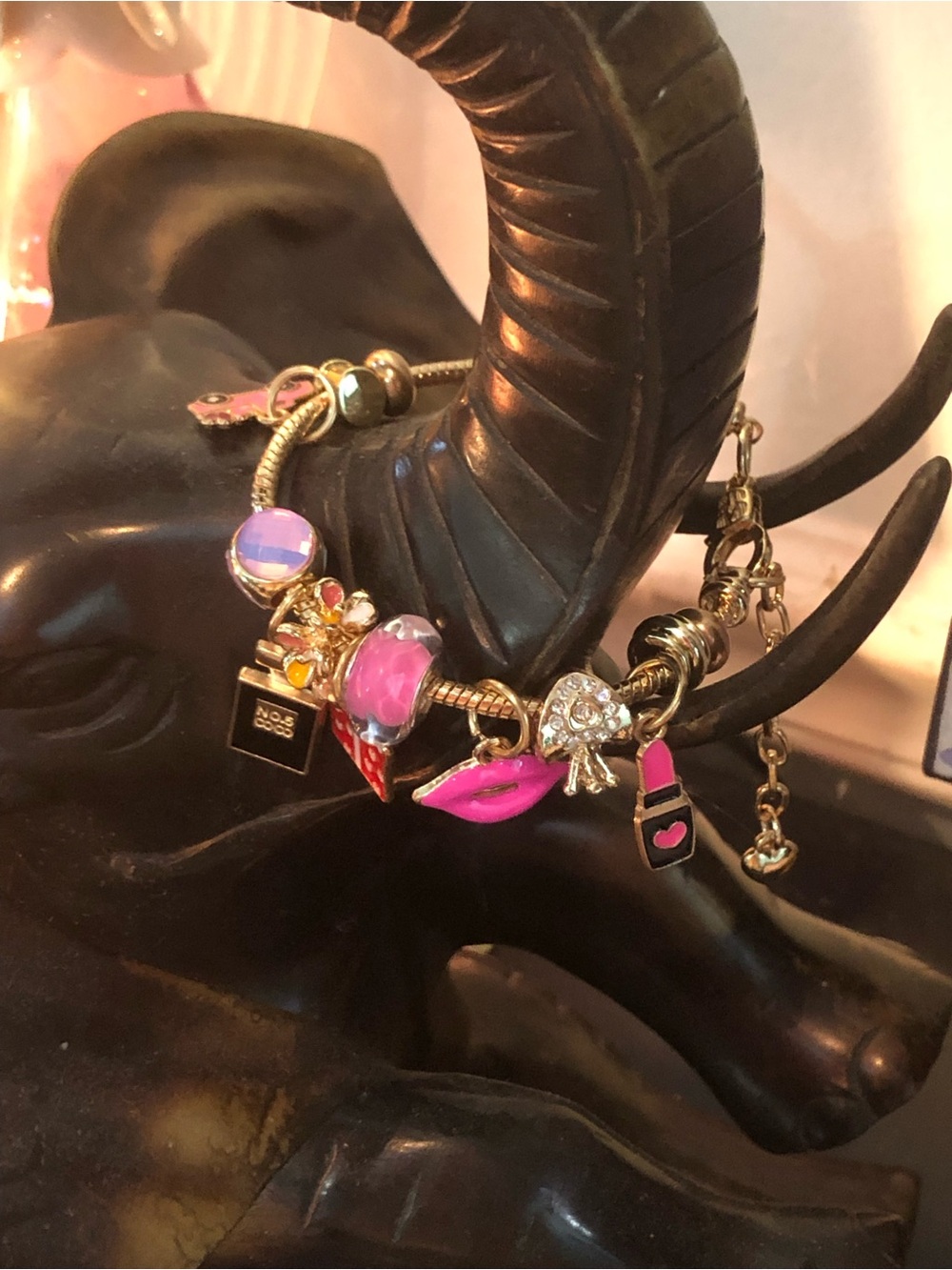 CHARM BRACELET: Gold-Tone Pink Charm Bracelet with Lip & Crystal Accents
